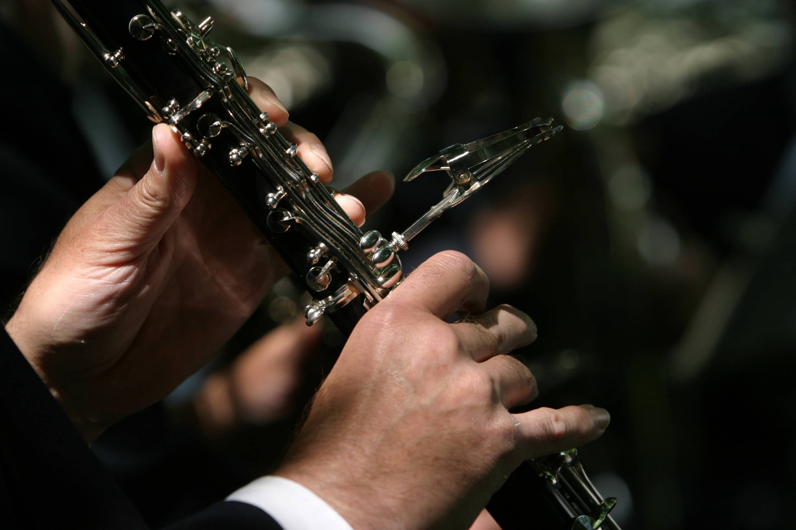 A close up of a clarinet being played