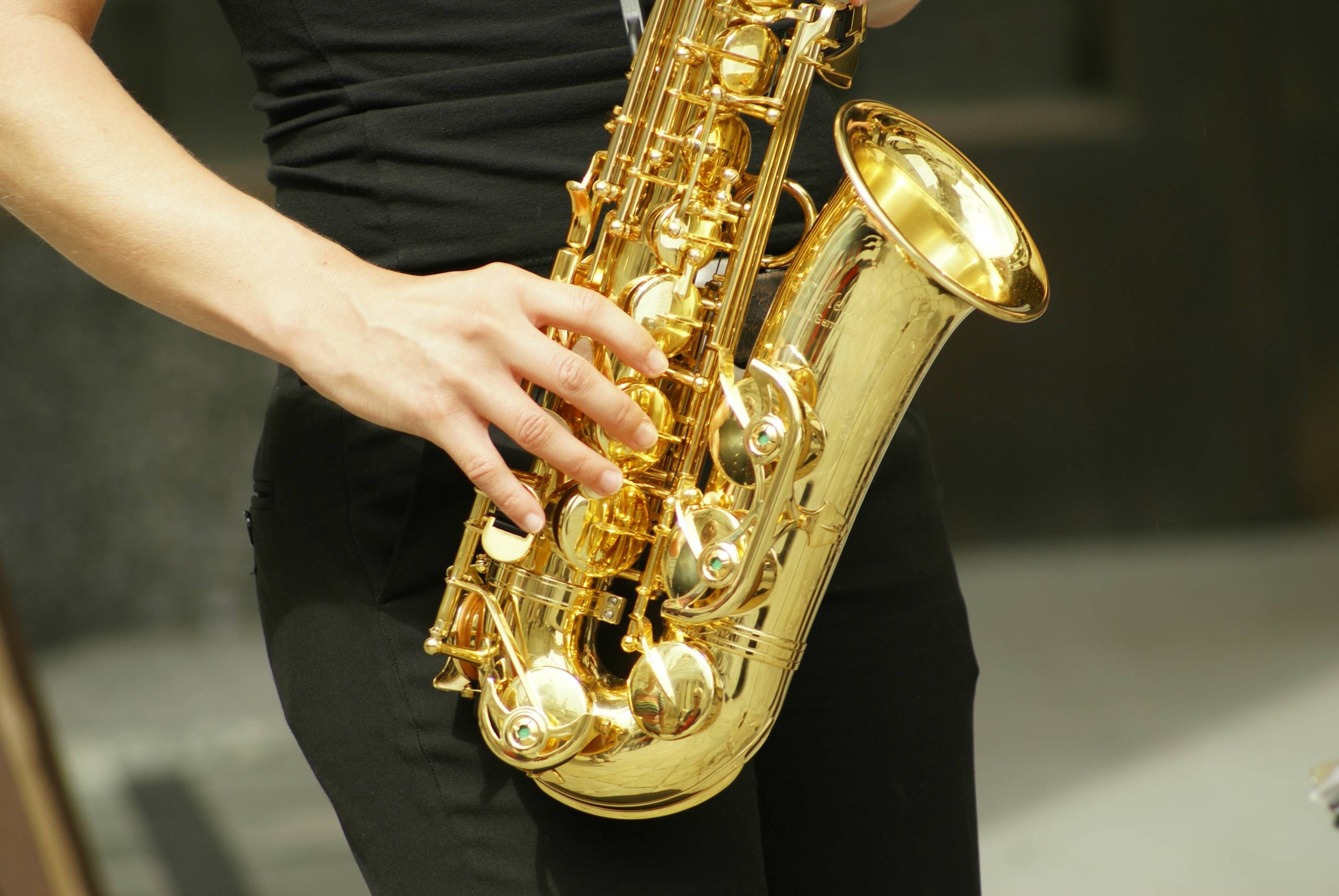 A close up of a saxophone being played